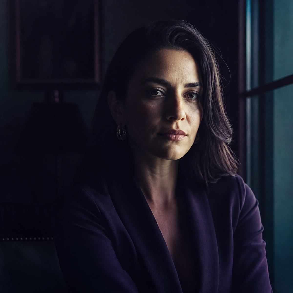 A verified member portrait in warm low light